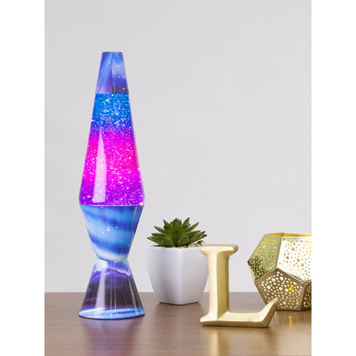 14.5” LAVA® Lamp Colormax Northern Lights – Glitter on a table with a succulent and a candle